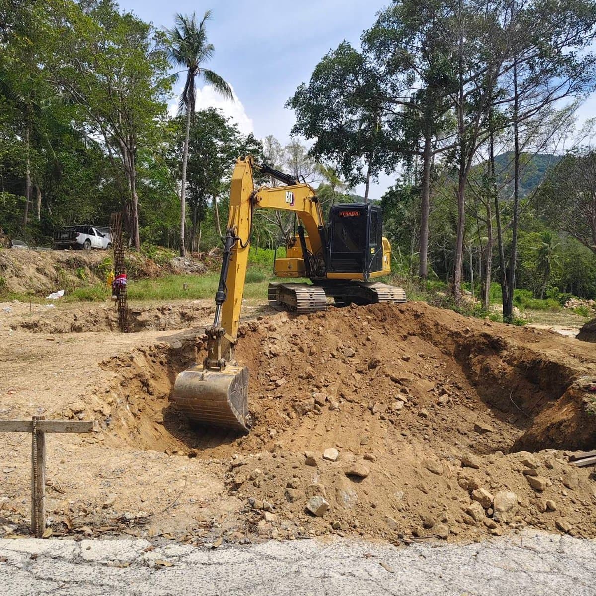 Excavator digging villa footings at Green Valley, Koh Phangan